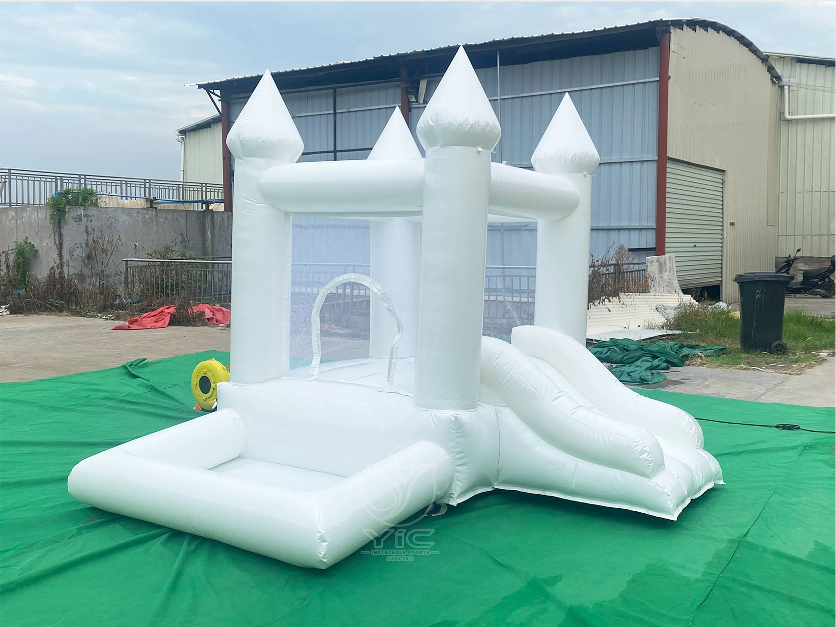 Small white bounce house with ball pit