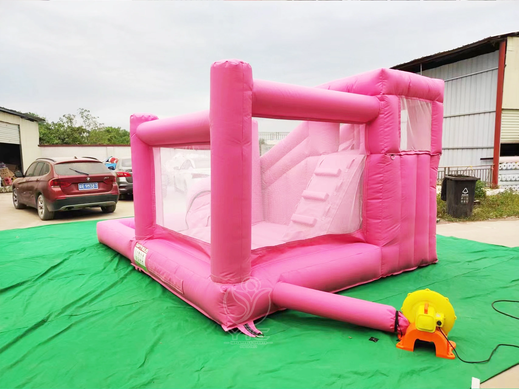 Pink bounce house with slide and ball pit product photo 4