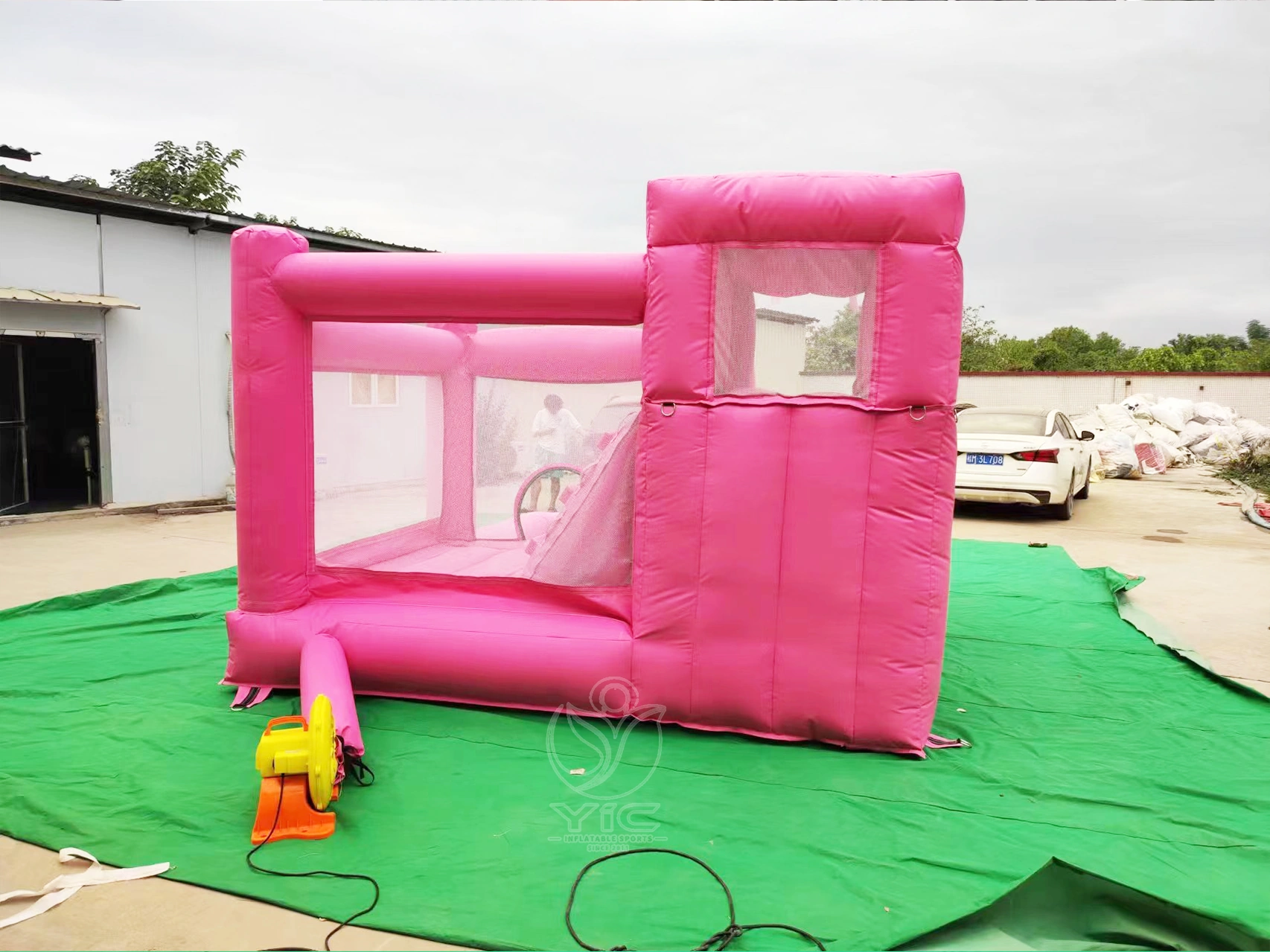 Pink bounce house with slide and ball pit product photo 5