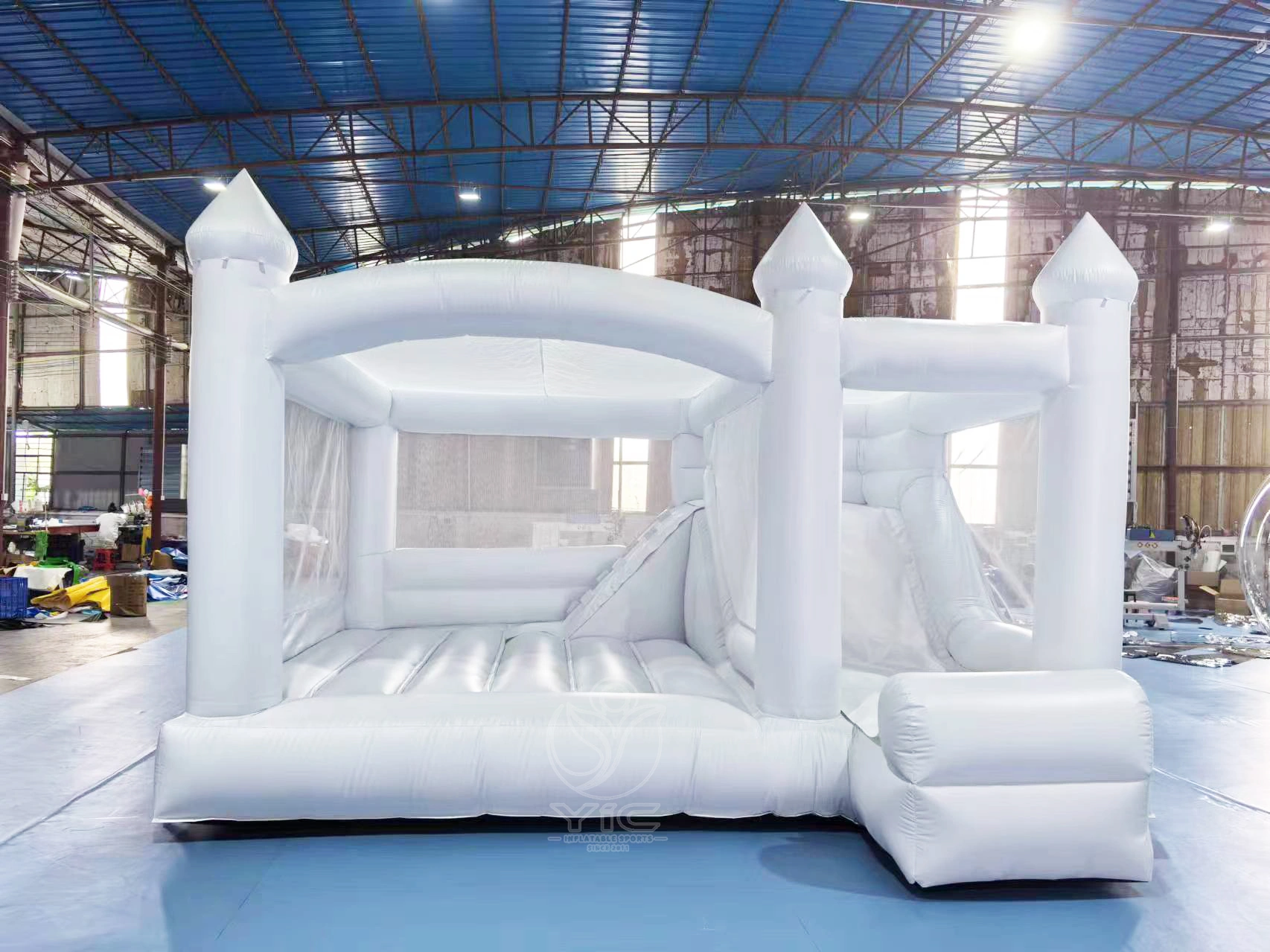 All white bounce house with slide