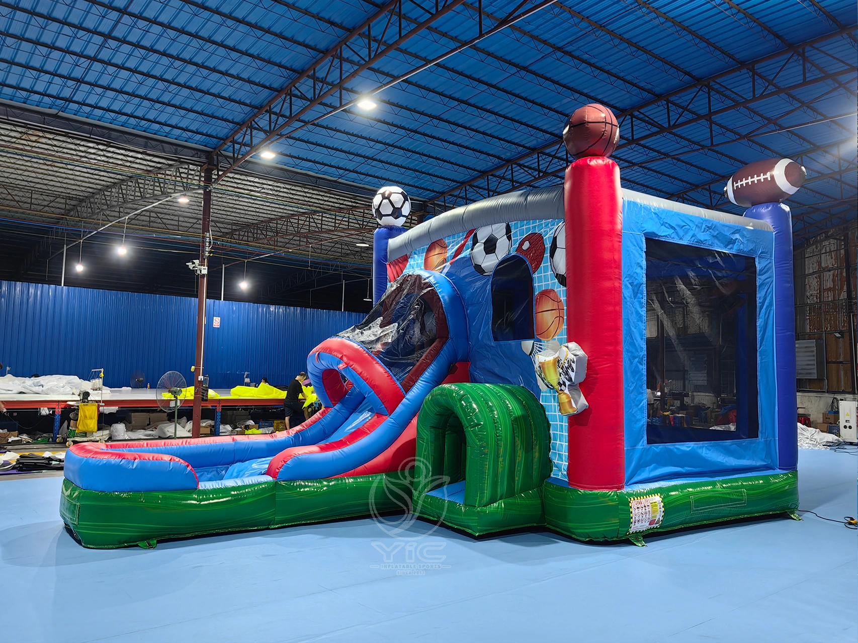 Inflatable bounce house with slide and basketball hoop