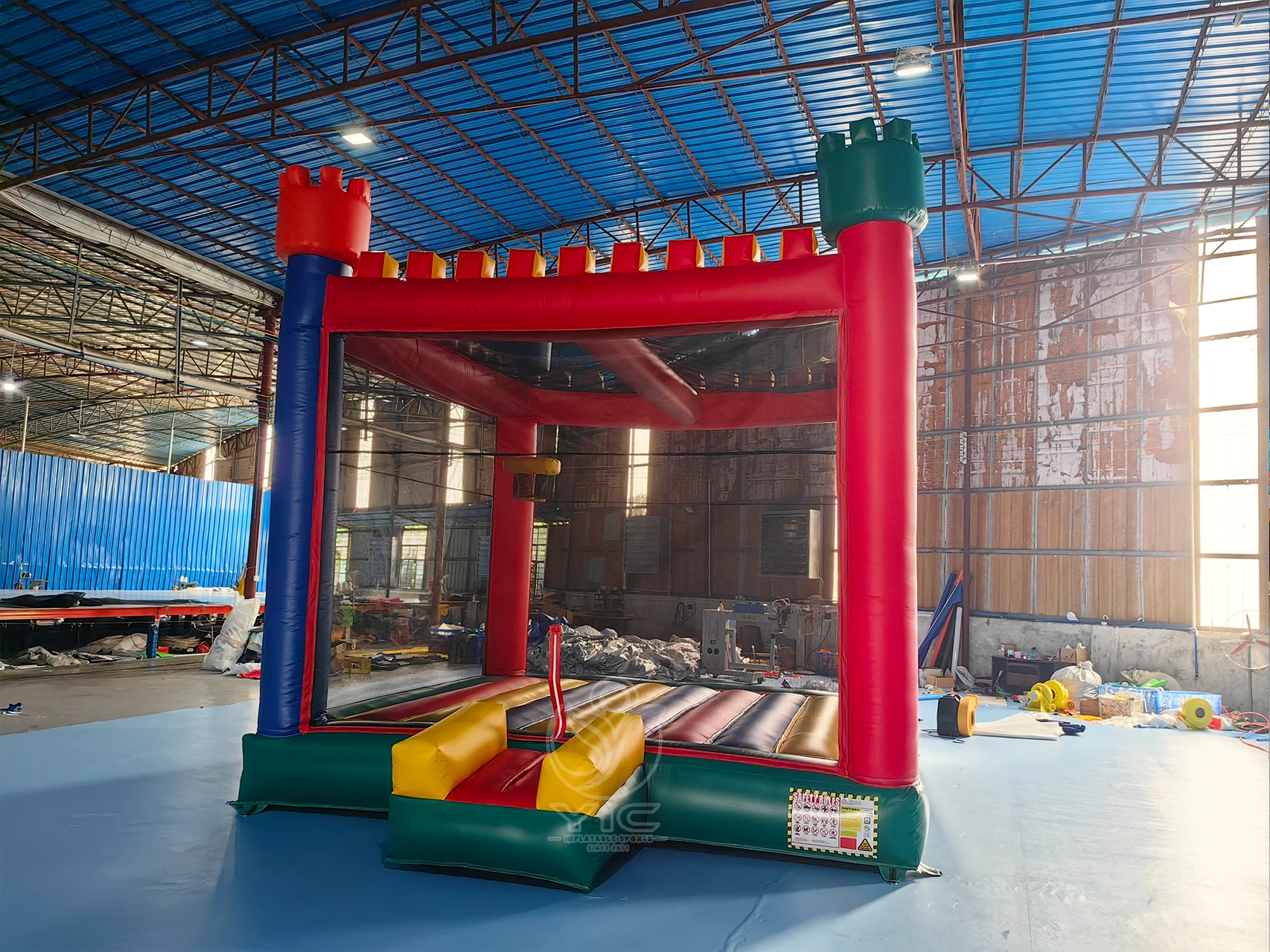 Bounce house with basketball hoop inside